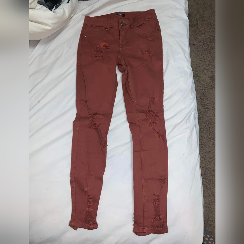 Size 2 Rue 21 burgundy ripped skinny jeans